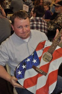 Andrew Cockerill, winner of the autographed Ted Nugent guitar to benefit the Ted Nugent Kamp for Kids in Omaha.